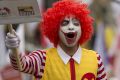 Demonstrators dressed as Ronald McDonald protest for better wages for McDonald's employees in Sao Paulo, Brazil. 