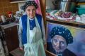 Stasia Dabrowski with her portrait, painted in oil by Canberra artist Jenny Blake.