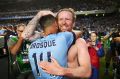 Alex Brosque and David Carney of Sydney celebrate after the penalty shoot-out in the 2017 A-League grand final.