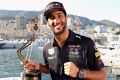 A "much happier" Ricciardo with this third-place trophy. 
