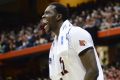 Louisville's Mangok Mathiang cheers his teammates on.