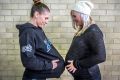 Nat Hurst (left) has returned to play with the Canberra Capitals pictured with her wife Tara Hurst who is 39 weeks pregnant. 