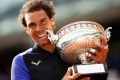 Rafael Nadal is jubilant as he holds the trophy.