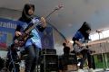 Widi Rahmawati (L) and Firdda Kurnia, members of the metal band Voice of Baceprot, perform during a school's farewell ...