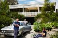 Sam, Gracie and Charlie with Fluffy the chicken outside their modernist home. “I’m caretaking a mate’s ZD Fairlane for a ...