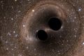 An artist's impression of two black holes merging.