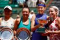 All smiles: (L-R) runners-up Ashleigh Barty and Casey Dellacqua, with winners Lucie Safarova and Bethanie Mattek-Sands.