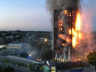 TOPSHOT - This handout image received by local resident Natalie Oxford early on June 14, 2017 shows flames and smoke coming from a 27-storey block of flats after a fire broke out in west London. The fire brigade said 40 fire engines and 200 firefighters had been called to the blaze in Grenfell Tower, which has 120 flats. / AFP PHOTO / Natalie Oxford / Natalie OXFORD / -----EDITORS NOTE --- RESTRICTED TO EDITORIAL USE - MANDATORY CREDIT "AFP PHOTO / Natalie Oxford" - NO MARKETING - NO ADVERTISING CAMPAIGNS - DISTRIBUTED AS A SERVICE TO CLIENTS - NO ARCHIVES