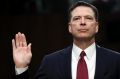 Former FBI director James Comey is sworn in during a Senate Intelligence Committee hearing on Capitol Hill, Thursday, ...