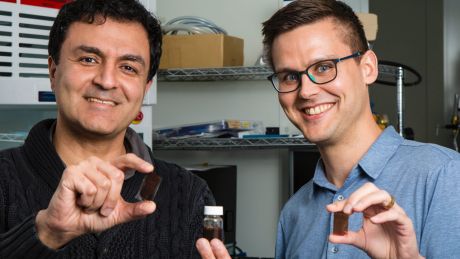 Dr Kourosh Kalantar-Zadeh and Dr Torben Daeneke at RMIT with their solar paint and samples painted on glass.?