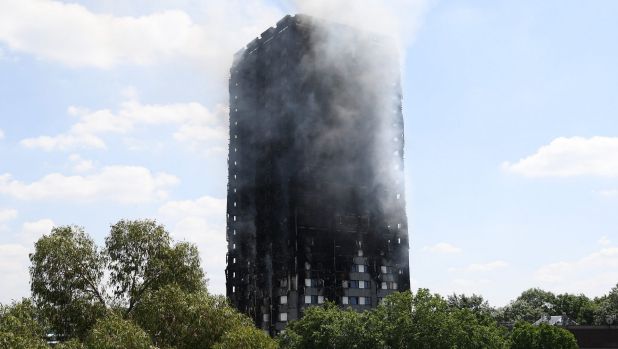 Smoke continues to rise from the burning 24-storey Grenfell Tower block in Latimer Road, west London.