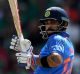 Captain's knock: Virat Kohli crunched an unbeaten 96 off 78 balls against Bangladesh to guide India into the Champions ...