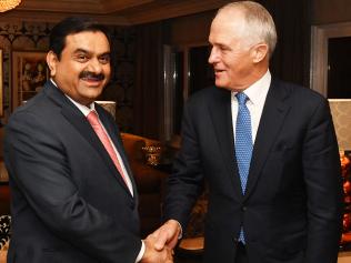 Australian Prime Minister Malcolm Turnbull (right) meets with India's Adani Group founder and chairman Gautam Adani in New Delhi, India, Monday, April 10, 2017. Prime Minister Malcolm Turnbull is looking to refresh and deepen Australia's relationship with India during a four-day visit to the subcontinent. (AAP Image/Mick Tsikas) NO ARCHIVING
