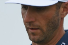 World No 1 Dustin Johnson of the United States walks off the course after missing the second round cut at the the 2017 ...