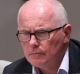 Veteran journalist Michael Gordon observes Question Time at Parliament House in Canberra. 