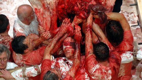 Participants in a Hermann Nitsch performance art piece at Burgtheater in 2005.