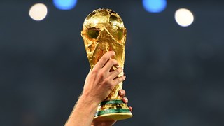 A close up of the World Cup trophy 