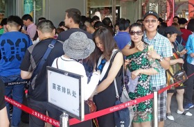 A crowd queuing outside popular new tea house Hey Tea.