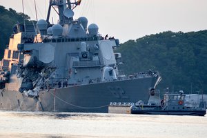 The Arleigh Burke-class guided-missile destroyer USS Fitzgerald (DDG 62) returns to Fleet Activities (FLEACT) Yokosuka following a collision with a merchant vessel while operating southwest of Yokosuka, Japan, June 17, 2017.