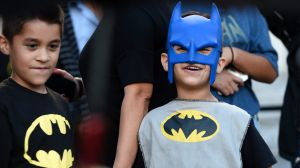 Twin brothers Augustine, left, and Vincent Reynoso, of Rancho Cucamonga, California, dress in Batman outfits at a ...