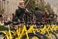 Commuters unlock shared bikes using their smartphones in Beijing.