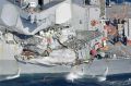 The damage on the starboard side of the USS Fitzgerald is seen off the Japanese coast.