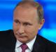 Russian President Vladimir Putin listens during his annual televised call-in show in Moscow on Thursday, June 15, 2017. ...