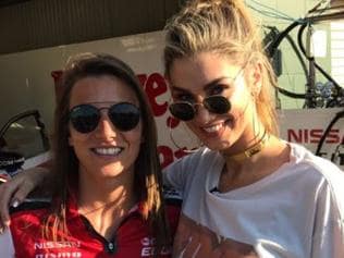 First full-time female driver in the Supercars Simona de Silvestro and singer Delta Goodrem at the V8 Supercars at Hidden Valley Raceway.