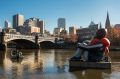 Artwork called Inflatable Refugee, pictured on the Yarra River on Saturday, is touring the globe to highlight the plight ...