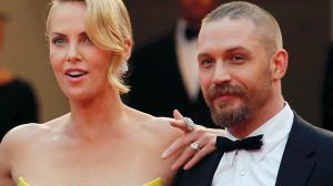 (L-R) Director George Miller, cast members Charlize Theron and Tom Hardy pose on the red carpet as they arrive for the ...