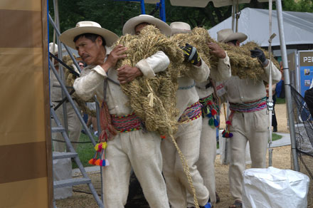 Once the ropes were finished, the bridge-building team carried them up the support structure. Photo by Josh Weillup, Ralph Rinzler Folklife Archives