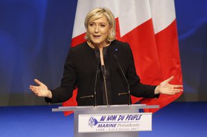 Far-right leader presidential candidate Marine Le Pen gestures as she speaks during a conference in Lyon, France, Sunday, Feb. 5, 2017.