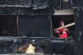 A London Fire Brigade officer inside the Grenfell Tower.