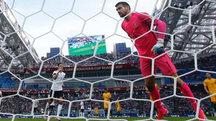 The Socceroos have lost 3-2 to Germany in the opening match of the Confederations Cup in Sochi.