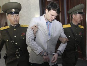 In this March 16, 2016, file photo, American student Otto Warmbier, center, is escorted at the Supreme Court in Pyongyang, North Korea.