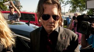 Dog of a day: Johnny Depp and Amber Heard at Southport Courthouse on Monday morning. 