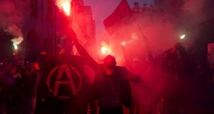 Members of the 20 February Movement carry flares during a demonstration on November 6, 2016 in the capital Rabat, to demand justice for a fish seller whose gruesome death, when he was crushed in a rubbish truck, sparked nationwide outrage.
Mouhcine Fikri, 31, was accidentally killed last on October 29, in the northern city of Al-Hoceima as he tried to protest against the seizure and destruction of swordfish, which are not allowed to be caught at this time of year. / AFP PHOTO / FADEL SENNA