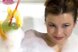 Young woman in a jacuzzi in luxury hotel.