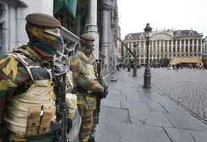 Belgium armed forces guard the Grand Place in Brussels, Belgium, Friday, Nov. 27, 2015.