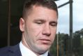 Former Sydney Roosters player Shaun Kenny-Dowall leaves Downing Centre Court after pleading guilty of drug possession 