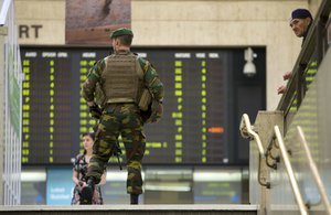 A Belgian Army soldier patrols inside Central Station in Brussels on Wednesday, June 21, 2017.