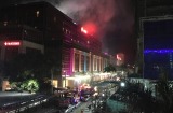 Gunshots and explosions rang out early Friday at a mall, casino and hotel complex near Manila's international airport in ...