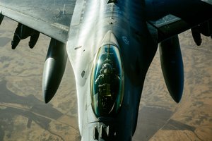 A US Air Force F-16 Fighting Falcon refuels from a 340th Expeditionary Air Refueling Squadron KC-135 Stratotanker  over Iraq, Jan. 11, 2017