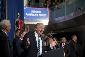 President Donald Trump, accompanied by Vice President Mike Pence, left, speaks before signing an Executive Order on "Improving Accountability and Whistleblower Protection" at the Department of Veterans Affairs, Thursday, April 27, 2017, in Washington.