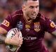 BRISBANE, AUSTRALIA - MAY 31: Darius Boyd of the Maroons takes on the defence during game one of the State Of Origin ...