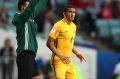 Tim Cahill prepares to come on during the FIFA Confederations Cup match against Germany. 