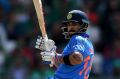 Captain's knock: Virat Kohli crunched an unbeaten 96 off 78 balls against Bangladesh to guide India into the Champions ...