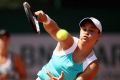 Ashley Barty and Casey Dellacqua (background) at the French Open.