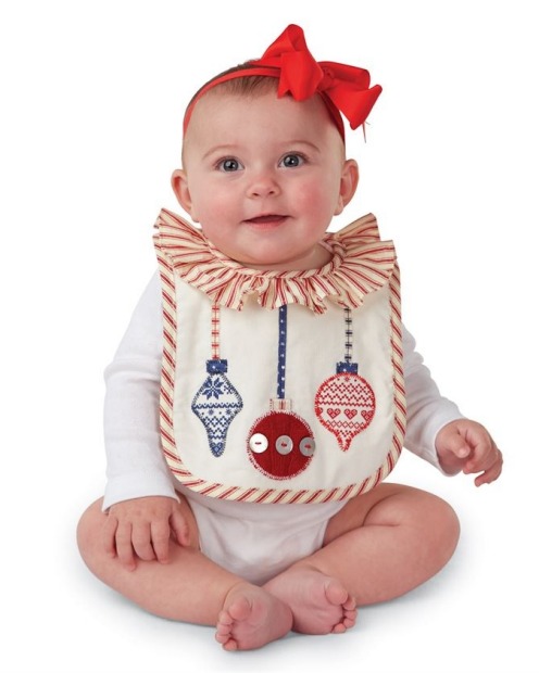 <a href="https://www.mud-pie.com/Ornament-Bib-1552220/" target="_blank">Ornament bib from Mud Pie</a>, $17