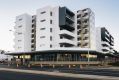 The Esque building on the corner of Flemington Road and Manning Clark Crescent in Franklin: The developers has offered ...